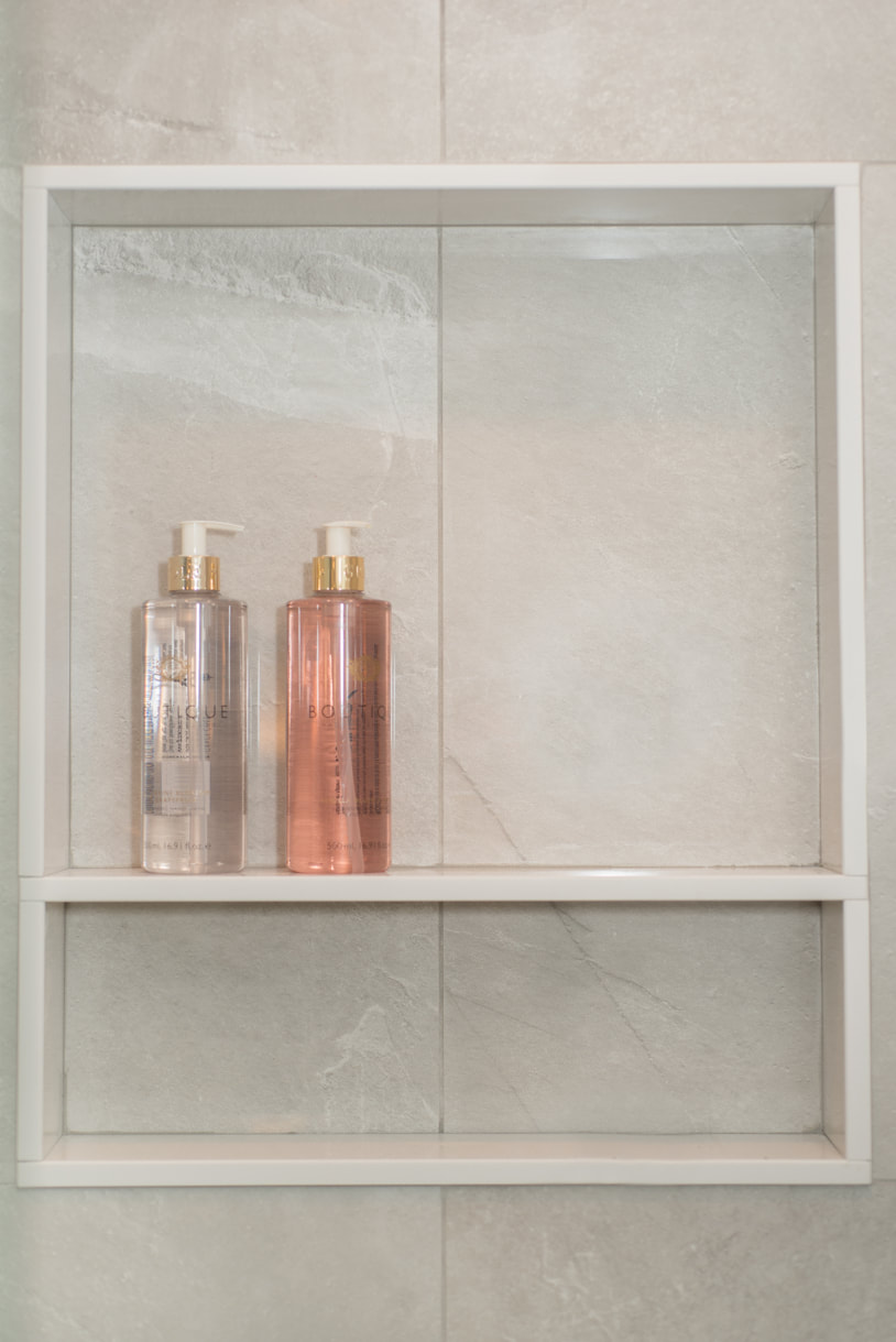 tiled shampoo niche in shower stall